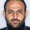 Roman Mitichyan as Hotel Clerk Gary