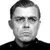 John Maxwell as Chief of Police