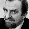 Hugh Griffith as Inspector Simmons