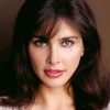 Lisa Ray as Dominique Ball