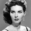 Lynn Cartwright as Fashion Show Host