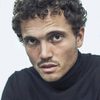 Karl Glusman as John