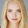 Olivia Boreham-Wing as Roland's Assistant