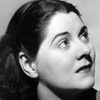 Gertrude Flynn as Shopkeeper