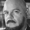 Simon Ellis as Bus Passenger