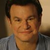 Robert Wuhl as Alexander Knox