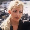 Glori-Anne Gilbert as Blonde in Tent on TV (archive footage) (uncredited)