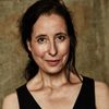 Caroline Ebner as Assistant Editor Judy