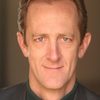 Ted Rooney as Coroner