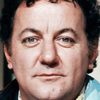 Coluche as The office manager