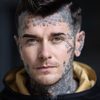 Baz Black as Tattoo Shop Owner