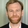 Brian Gleeson as Simon