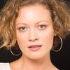Annick Weerts as Restaurant Hostess