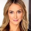 Shira Scott Astrof as American Reporter