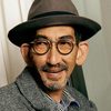Paul Che Biu-Law as Chinese Man in Spectacles