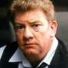 Charles Hallahan as Norris