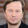 Piotr Cyrwus as Priest
