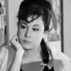 Artemis Theodorakopoulou as hotel maid