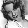 Gloria Blondell as Janie - Cafe Photographer