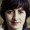 Dilyana Bouklieva as 1. Police Officer. 2. Charity organisation employee