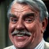 Windsor Davies as Sergeant Major "Tiger" Bloomer