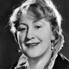 Julia Serda as Clara, his wife