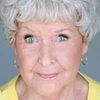 Jane Hall as Secretary Carol