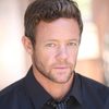 Simon Potter as Logan