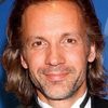 Michael Riley as Greg