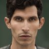 Alexander Devrient as Qamar Ayad