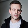 Oliver Devoti as Ticket Agent