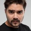 Yuriy Muzychenko as Solist russkogo khora(The Hatters)