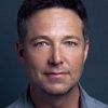 George Newbern as Father Lyle Dey