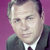 Howard Keel as King Cameron