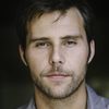 Justin Miles as Travis Romine