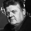 Robbie Coltrane as Ticket Seller