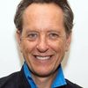 Richard E. Grant as Tom Oakley