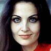 Olga Karlatos as Woman in Puppet Theatre