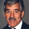 Dennis Farina as Coach John Bailey