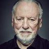Kenneth Cranham as Chairman Collins