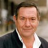 Michael Elphick as Burke