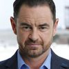 Glenn Keogh as British Anchor