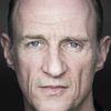 Stuart Bowman as Black Steet Pub Man