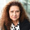 Joëlle Haddad Champeyroux as The Bureaucrat