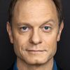 David Hyde Pierce as Father Conor