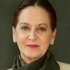 Gloria Laso as Checkpoint Battered Woman