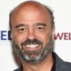 Scott Adsit as Archie MacIntosh