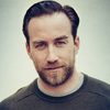 Justin Benson as Handsome Officer