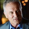 John Posey as Coach Tennent