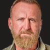 Byron Gibson as King Arthur